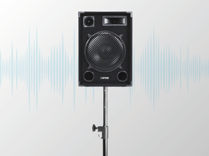 Black wall-mounted device shown against light blue wall background. Multiple angles of what appears to be a ventilation or electronic unit.