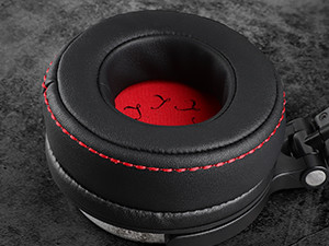 a pair of headphones with red stitching