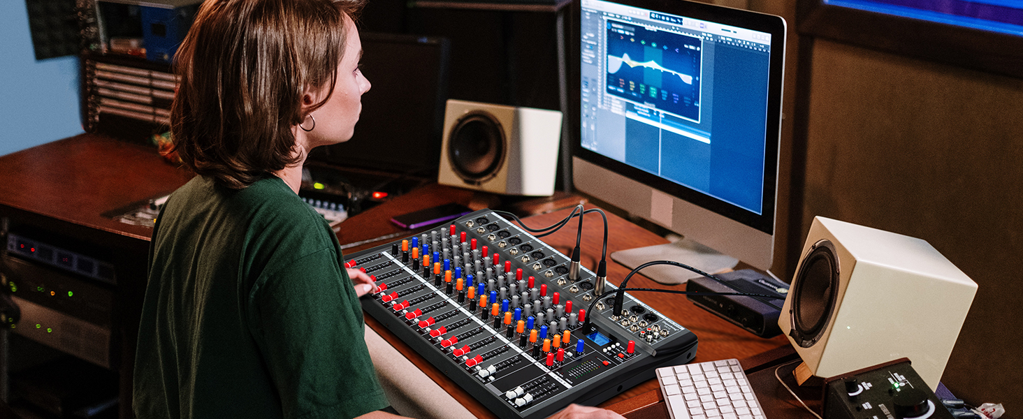 a woman working on a soundboard in a recording studio