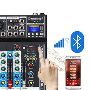 Audio mixing console with multiple channel faders, knobs, and buttons. Shows hand adjusting settings and smartphone with Bluetooth connectivity.