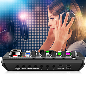 Audio mixing console with colorful illuminated buttons and faders. Device features multiple inputs and outputs for professional sound control.