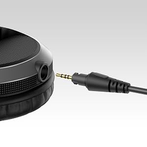 Close-up shots of black audio equipment, showing connection ports and audio cable being inserted into a jack.