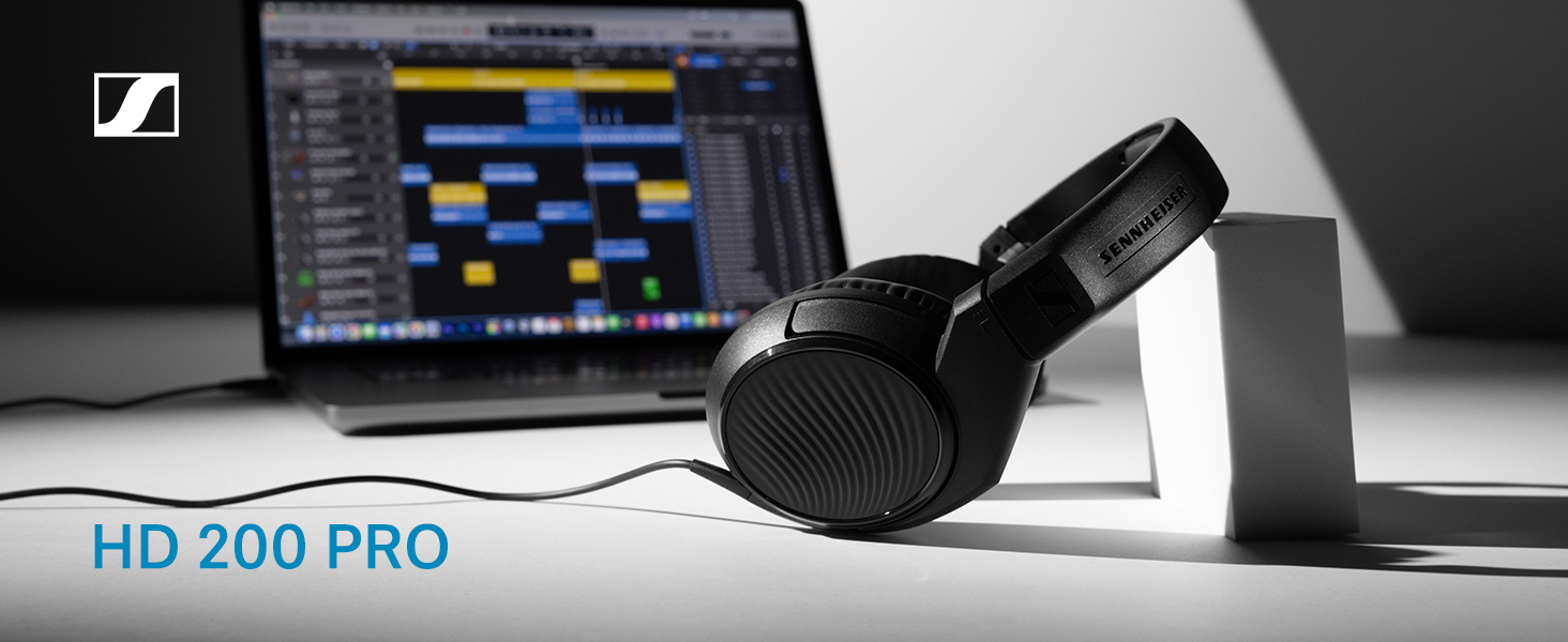 Text reads 'HD 200 PRO'. Professional headphones shown next to computer monitor displaying audio software interface.